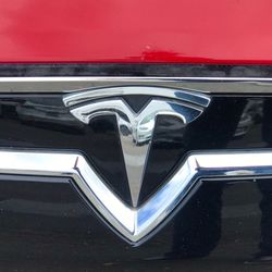 Close-up of heart shape on red car mirror