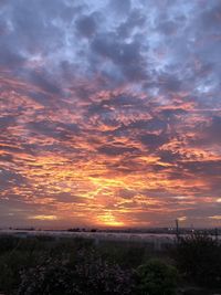 Scenic view of dramatic sky during sunset