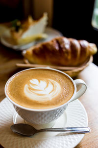 Close-up of cappuccino on table