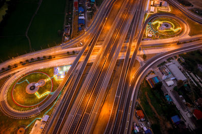 High angle view of light trails on highway in city