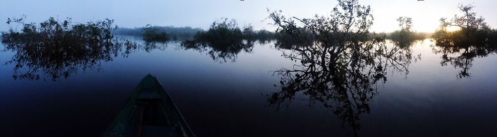 Scenic view of lake at sunset