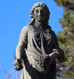 Low angle view of statue against sky