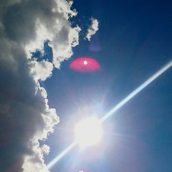 Low angle view of sun in sky