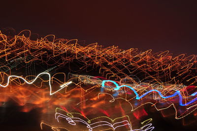 Light trails against sky at night