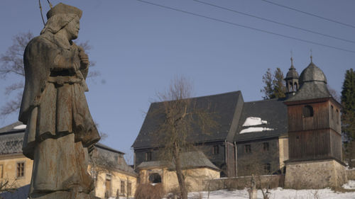 Low angle view of statue against sky