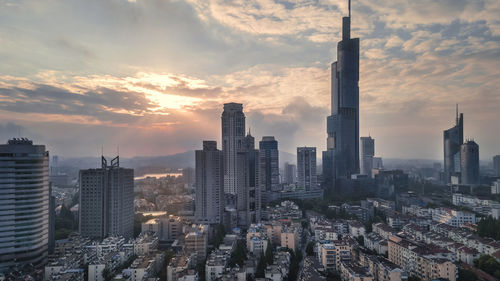 Cityscape against sky during sunset