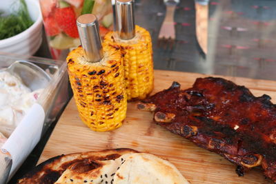 High angle view of meat on barbecue grill