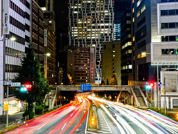 High angle view of light trails on city street at night