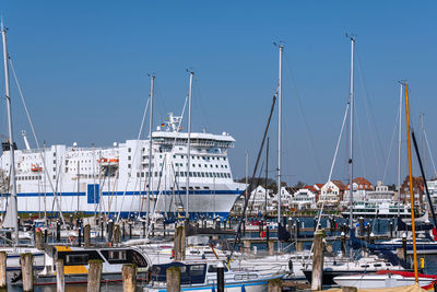 Boats moored at harbor