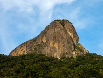 Low angle view of rock formations against sky