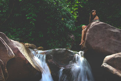 Panoramic shot of waterfall in forest