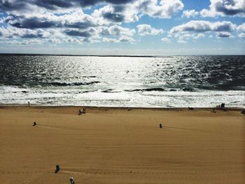 Scenic view of sea against cloudy sky