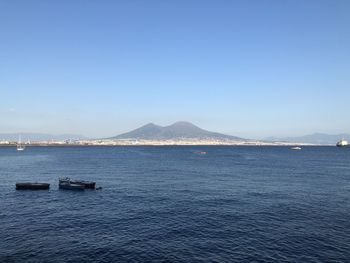 Scenic view of sea against clear blue sky