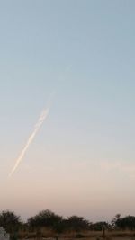 Low angle view of vapor trails in sky