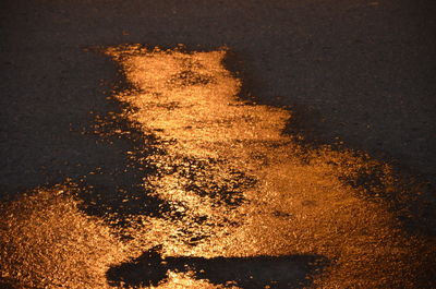 Close-up of illuminated road at night