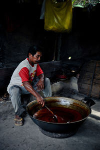 Full length of man preparing food