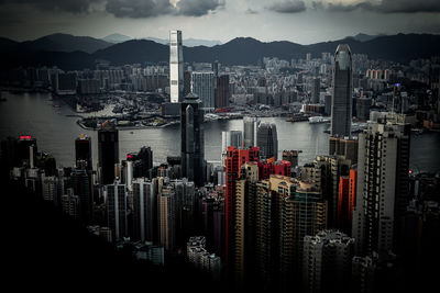 High angle view of buildings by sea against sky