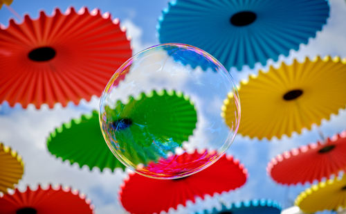 Low angle view of multi colored toy against gray background