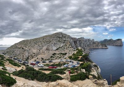 Panoramic view of rocks and sea against sky