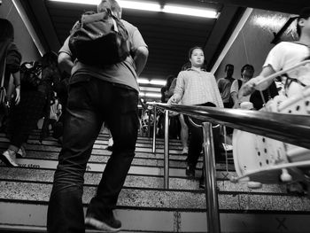 People standing on railing