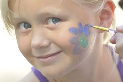 Close-up portrait of cute girl with face paint