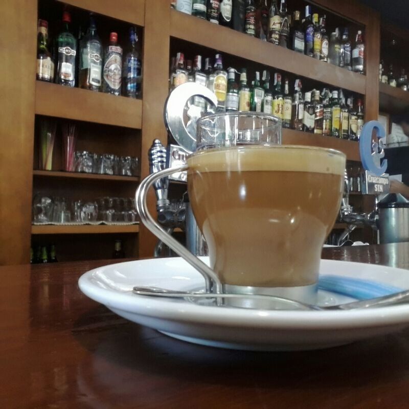 indoors, table, drink, still life, food and drink, coffee cup, refreshment, saucer, no people, cup, close-up, coffee - drink, shelf, coffee, arrangement, glass - material, window, reflection, cafe, empty