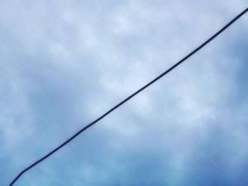 Low angle view of cables against sky