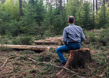 Rear view of man in forest