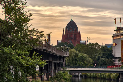 View of buildings against cloudy sky
