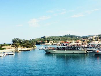 Scenic view of sea and buildings against sky