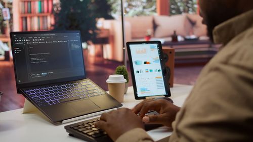 Midsection of man using laptop