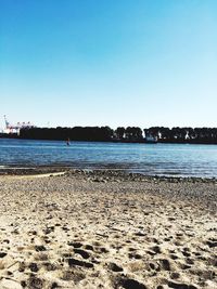 Scenic view of calm sea against clear sky