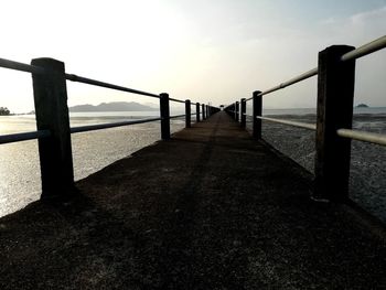 Pier over sea against sky