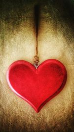 Close-up of red heart shape on table