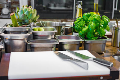 Close-up of utensils on table in kitchen