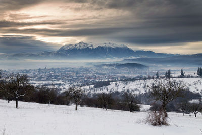 Scenic view of snow field against sky