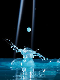 Close-up of water splashing on black background