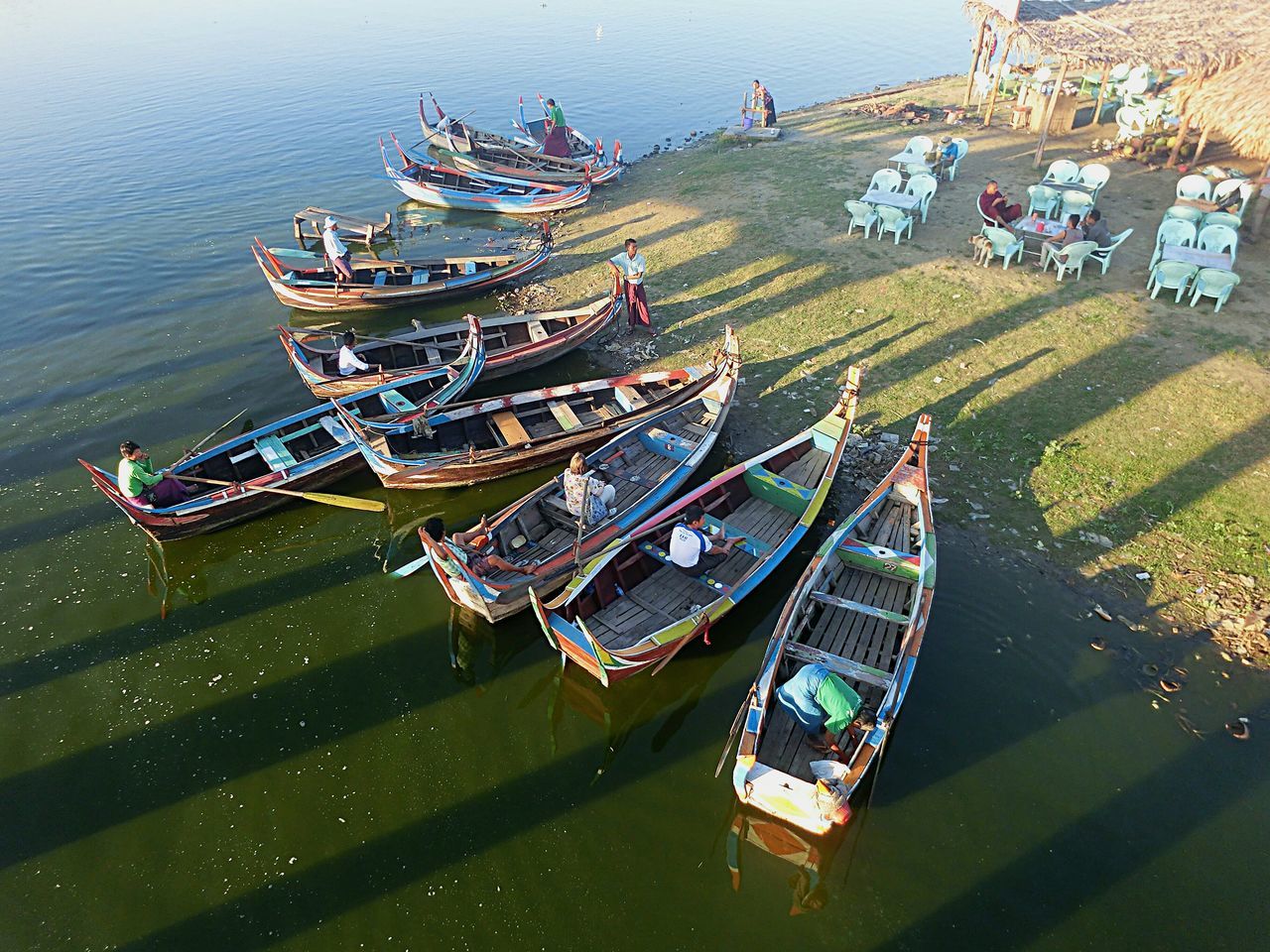 water, nautical vessel, mode of transport, transportation, boat, sea, moored, high angle view, waterfront, travel, beach, nature, outdoors, day, incidental people, sky, tranquility, vacations, shore, travel destinations