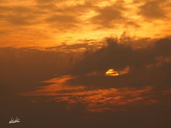 Scenic view of dramatic sky during sunset