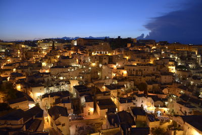 High angle shot of townscape against sky at night