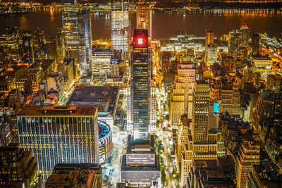 High angle view of illuminated buildings in city at night