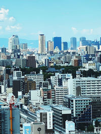 Modern buildings in city against sky