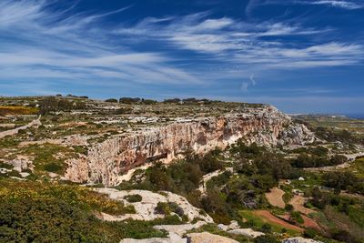 Rock formation and landscape against sky