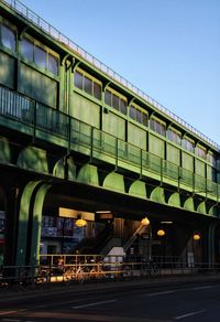 Low angle view of bridge against sky at evening