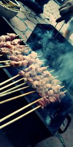 High angle view of meat on barbecue grill