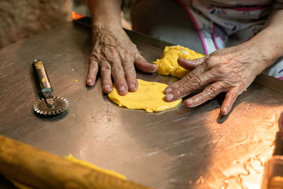 High angle view of man preparing food on table