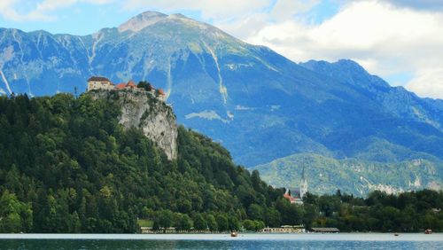 Scenic view of lake by mountain at bled