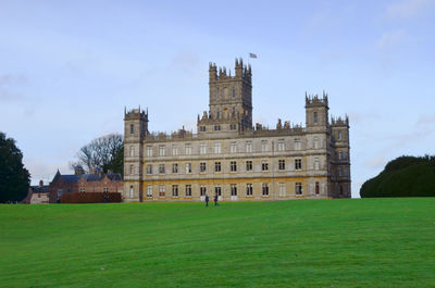 Building against sky with lawn in foreground