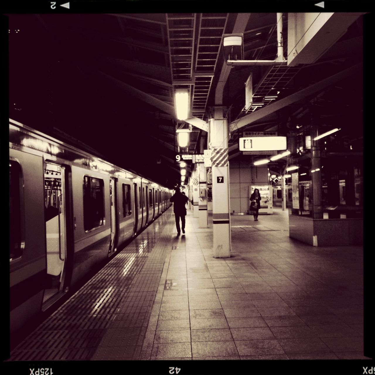 architecture, built structure, transfer print, transportation, railroad station platform, men, walking, railroad station, illuminated, public transportation, city life, indoors, the way forward, auto post production filter, lifestyles, person, city, building exterior, full length