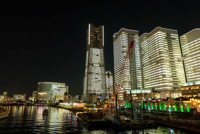 Illuminated buildings in city at night